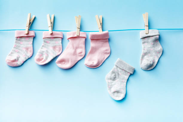 istock Baby Goods: Baby Socks on a Washing Line Still Life 1184812376