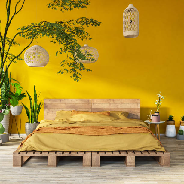istock Yellow Bedroom with Exotic Plants and Lights 1184812410