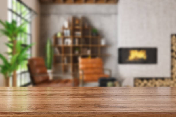 Wooden Table Top with Blur of Cozy Living Room Wooden Table Top with Blur of Cozy Living Room. 3d Render wooden desk stock pictures, royalty-free photos & images