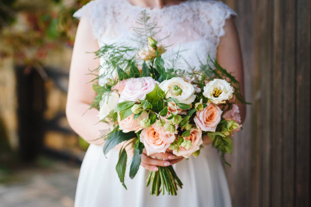istock Wedding bouquet in bride's hands 1184812829