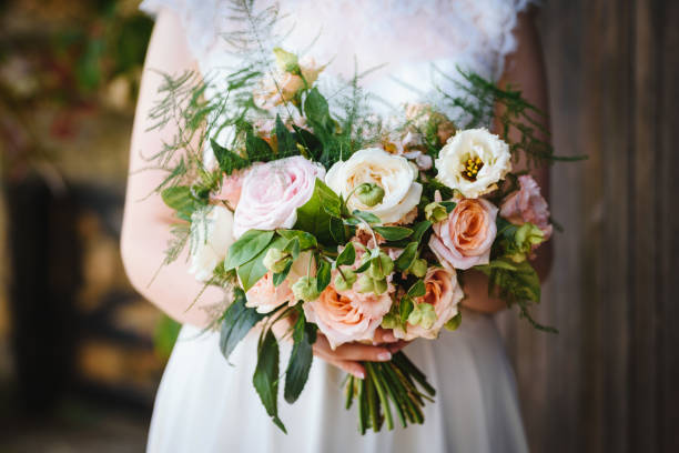 istock Wedding bouquet in bride's hands 1184812833