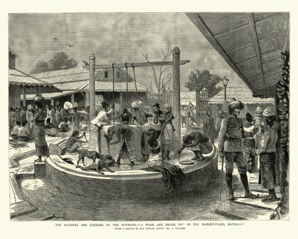 Vintage engraving of Burmese people washing themselves at a public well, Victorian, 1886, 19th Century.  A wash and brush up in the market place, Mandalay, Burma.  By F Villiers