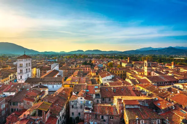 Lucca panoramic aerial view of city and San Michele in Foro Cathedral at sunset. Tuscany, Italy, Europe.