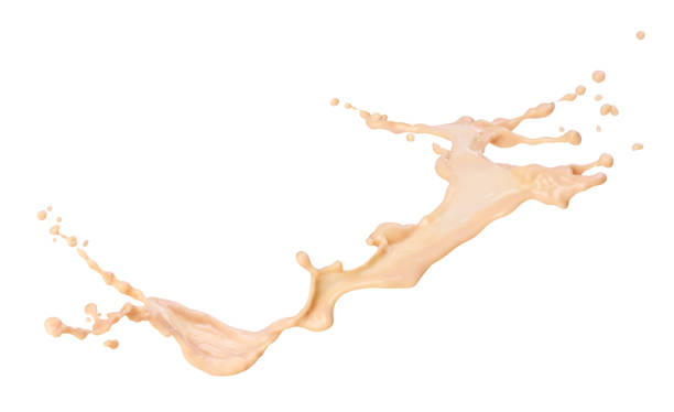 istock Coffee splash with milk on a white background 1184816329