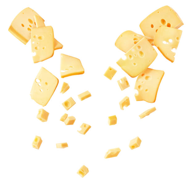 Hard cheese cut into strips and cubes isolated on a white background stock photo
