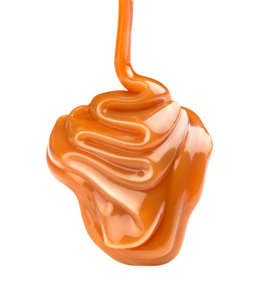 istock liquid flowing caramel on a white background 1184816336