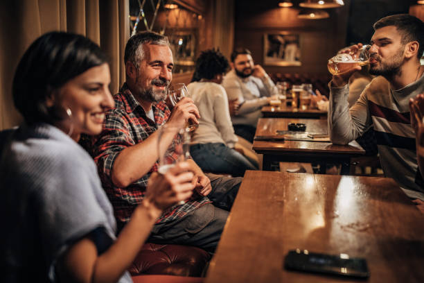 istock Group of people in the pub 1184816352