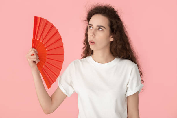 istock Exhausted millennial lady suffering from heat stroke. 1184817673