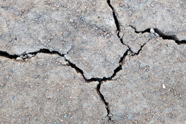 istock Close up of dry cracked ground surface. 1184818302