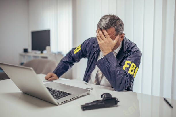 istock Concerned FBI agent in the office 1184820883