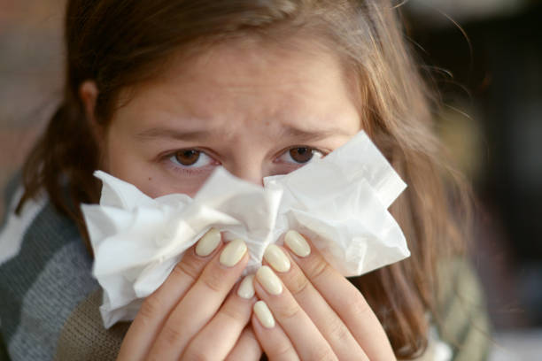 istock young girl is sick in the room 1184820926