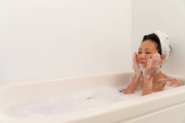 istock Woman relaxing in bubble bath 1184821011