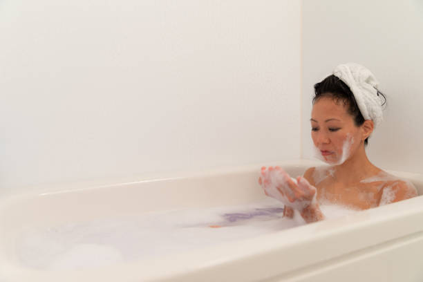 istock Woman relaxing in bubble bath 1184821038