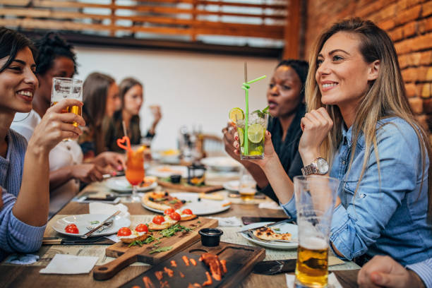 istock Women sitting outdoors in restaurant 1184821118