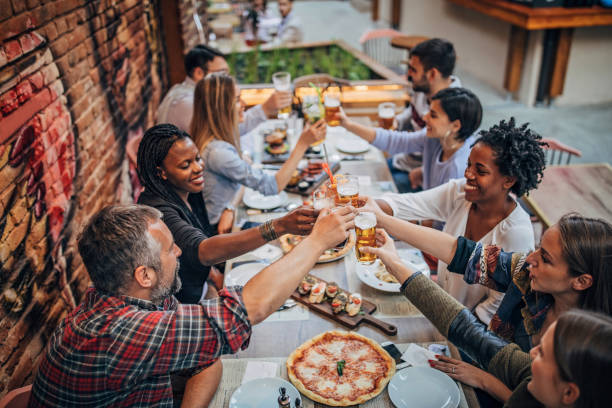 istock Friends sitting outdoors in restaurant 1184821870