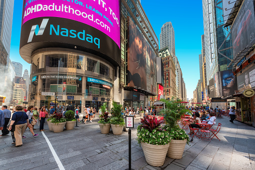 Broadway near Time Square and NASDAQ building on July 2, 2019 in New York, NY. Times Square is the most visited tourist attraction in the world.