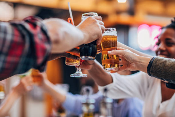 istock Friends drinking beer outdoors in the pub 1184823130
