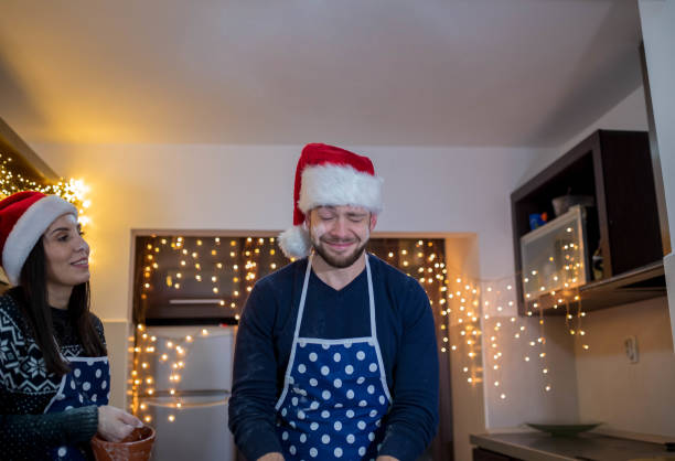 istock Young couple celebrating Christmas in kitchen 1184823334