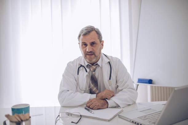 istock The old doctor works in a doctor's office 1184826365