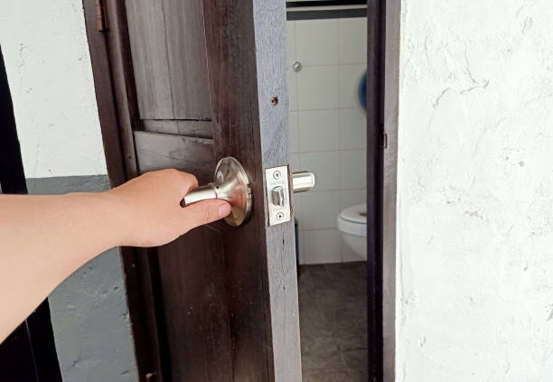 istock A man is opening the bathroom 1184826627