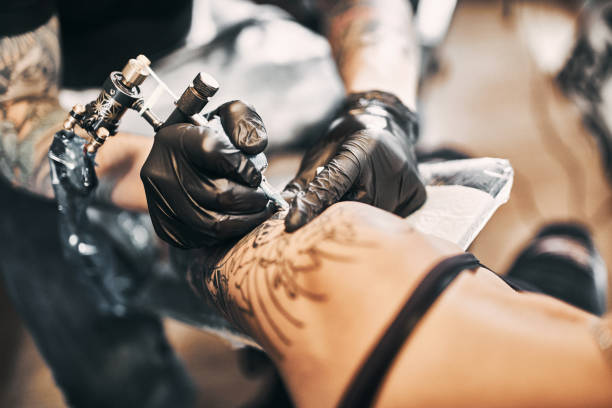 istock Tattooing a shoulder. Close-up shot 1184829120