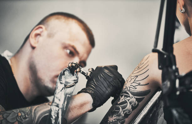 istock Tattooing a shoulder. Close-up shot 1184829280