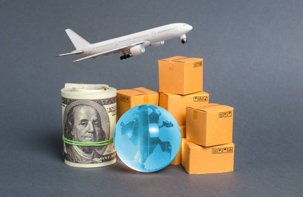 istock A stack of boxes, airplane a bundle of dollars and a blue planet earth globe. World trade and commodity exchange. commerce traffic trading balance. Import, export, transit of products. 1184829740