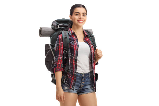 istock Young female hiker with backpack smiling at the camera 1184832564