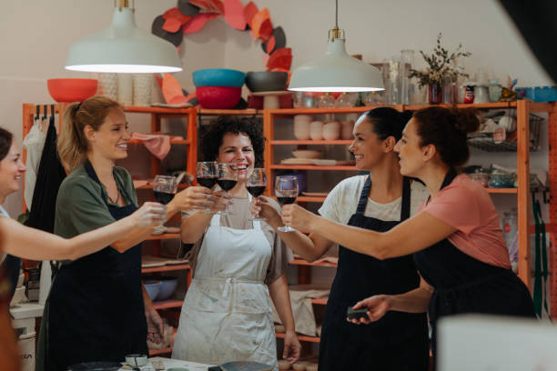 istock Women Toasting With Red Wine On Ceramics Class 1184833422