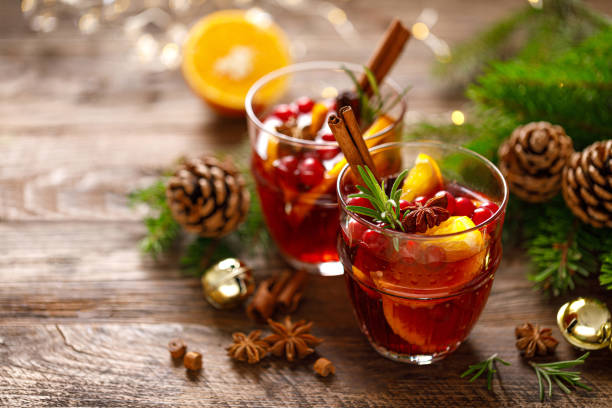 istock Christmas mulled wine. Traditional festive drink with decorations and fir tree 1184833642