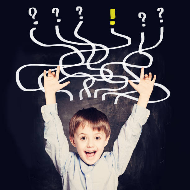 istock School Boy has an idea. Concept with question signs 1184833898