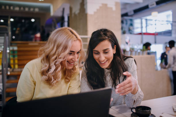 istock Two Businesswomen Using Smart Phone 1184835657