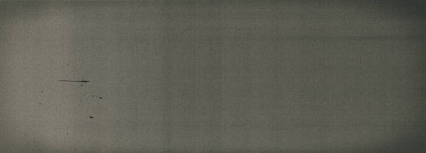istock Noisy film frame with heavy noise, dust and grain 1184836249