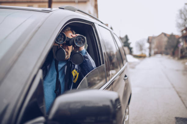 istock An old FBI agent uses binoculars 1184836358