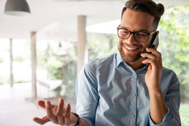 istock Smiling man talking on mobile phone 1184836776