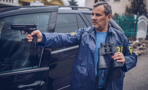 istock An FBI agent uses a gun in action 1184837882