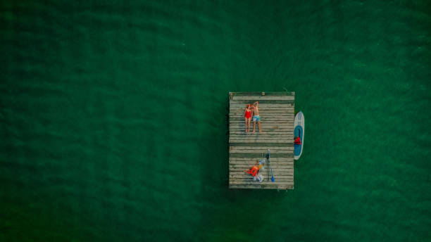 istock Young couple enjoy summer on a lake 1184838331