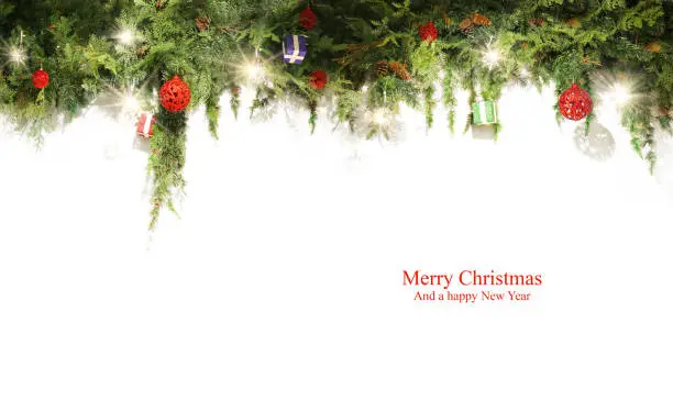 Christmas background with fir branches and red balls with decorations