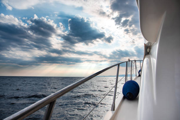 istock View from yacht on storm clouds and sun rays over the sea. 1184842257