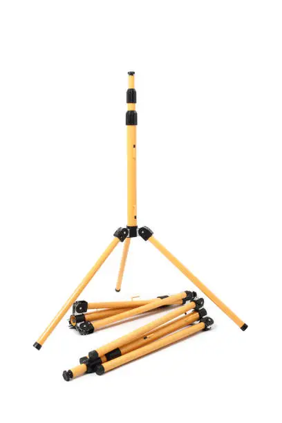 Photo of Telescoping industrial tripod work. Isolated with handmade clipping path.