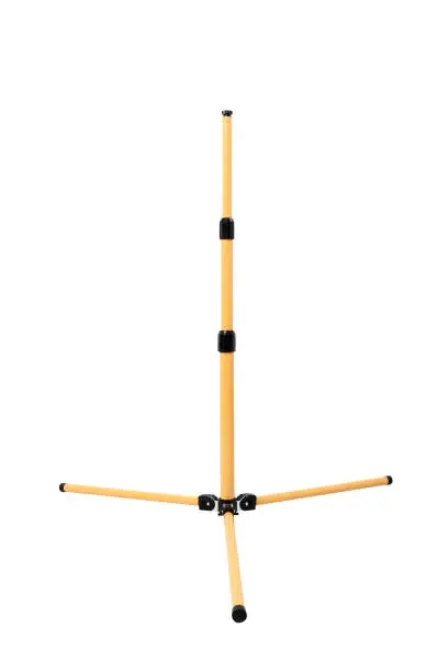 Photo of Industrial tripod stand. Isolated with handmade clipping path.