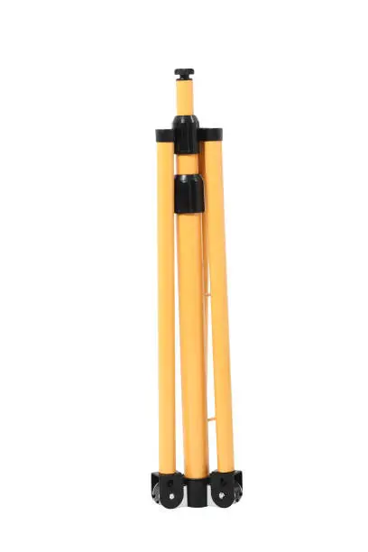 Photo of Telescoping industrial tripod. Isolated with handmade clipping path.