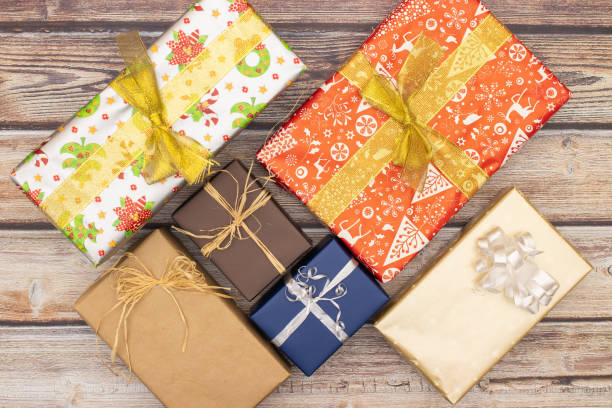 istock Christmas present on wooden table 1184843804