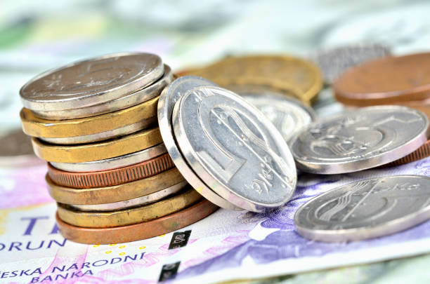 istock Close-up of different Czech coins on banknotes 1184846072