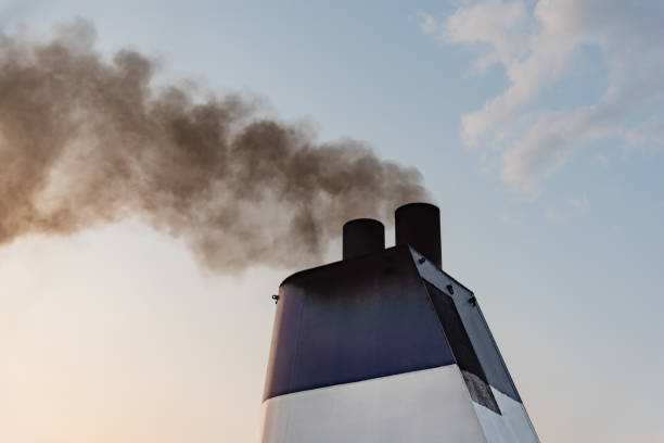 istock Ferry boat exhaust pipe blowing smoke in the sky 1184846294