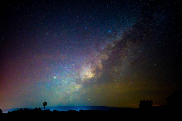istock Beautiful milky way galaxy on dark night sky background 1184846376