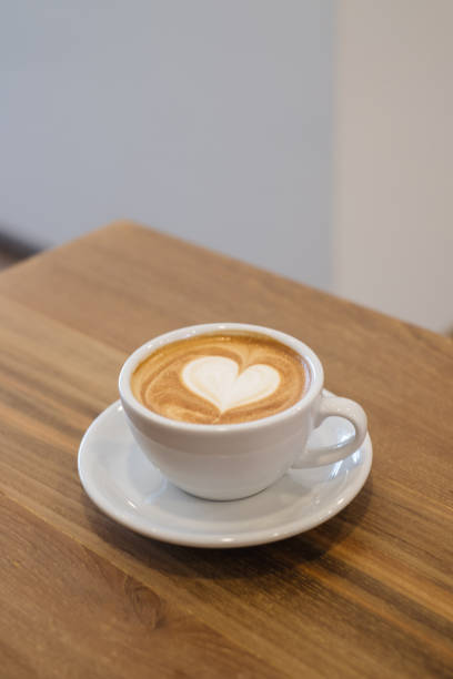 istock Hot Art Latte Coffee Cup On the wooden table. 1184847056