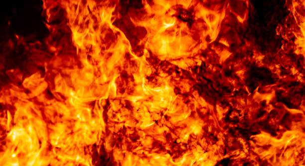 istock Red hof fire flame burn fuel glowing on black background 1184847410