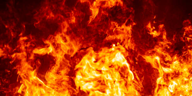 istock Red hof fire flame burn fuel glowing on black background 1184847422
