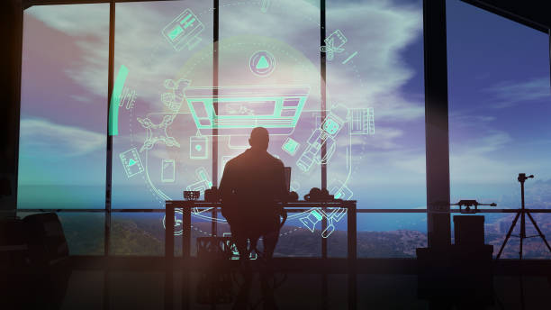 istock A silhouette of a videographer in studio working with a virtual interface. 1184847707
